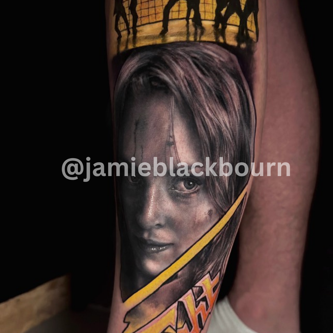 Tattoo of a person's face with a yellow stripe on an arm, credit to @jamieblackbourn.
