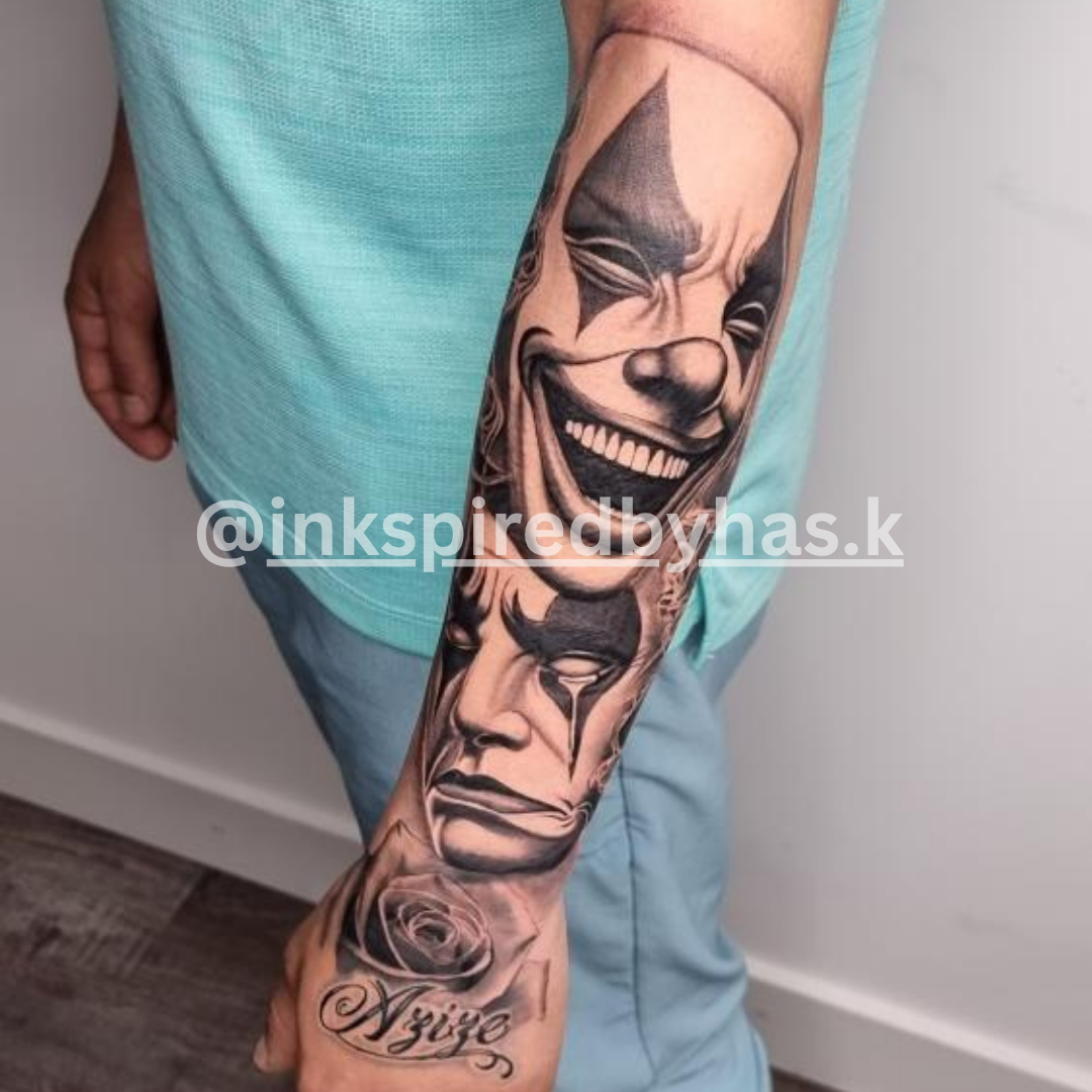 Tattoo of a mask design on a person's arm with a visible brand watermark.