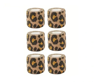 Six rolls of leopard print tattoo grip tape on a white background