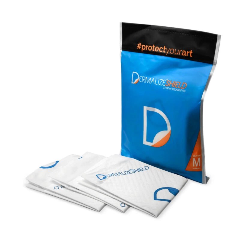Dermalize Shield ultra thin absorbent pads packaging with multiple packets on a white background