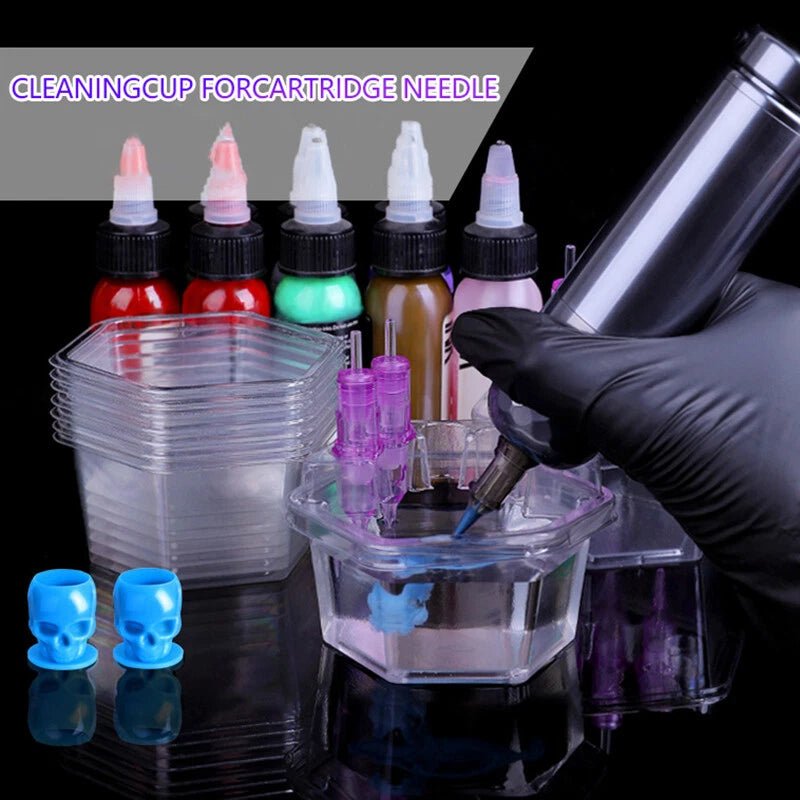 Tattoo ink bottles, cleaning cup, and needle cleaner on a reflective surface with text 'Cleaning Cup for Cartridge Needle'.