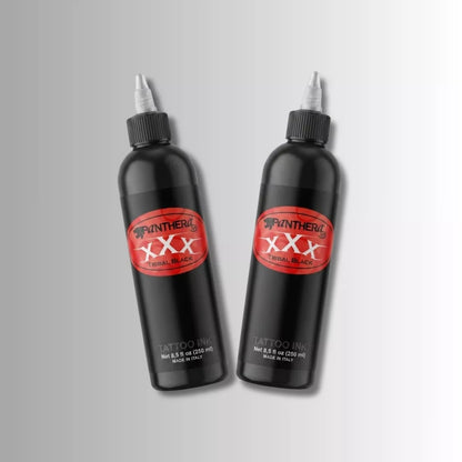Two Panthera XXX Tribal Black tattoo ink 250ml bottles with white nozzle caps, featuring red and black Panther Ink XXX branding, displayed on a light gray gradient background.