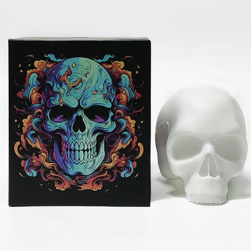 A white boxed skull tattoo practice model for studio display, which features a colorful, vibrant skull illustration with blue, purple, orange, and red tones.