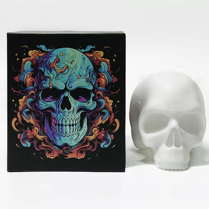 A white boxed skull tattoo practice model for studio display, which features a colorful, vibrant skull illustration with blue, purple, orange, and red tones.
