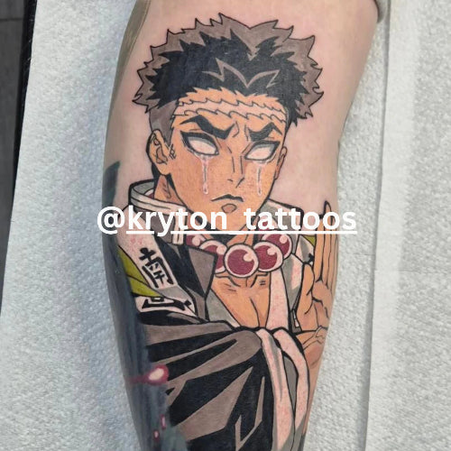 Tattoo of an anime character on a person's arm with 