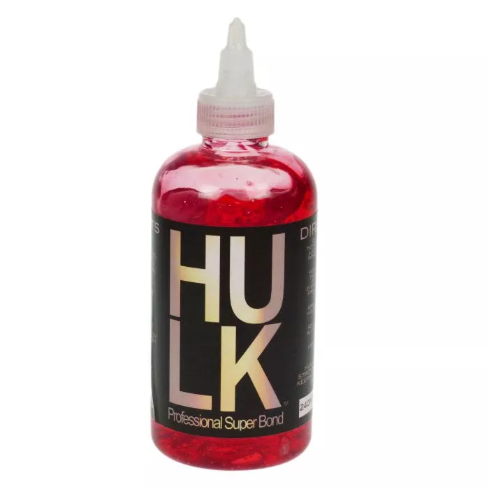 Bottle of Hulk Professional Super Bond with red gel and white cap on a white background