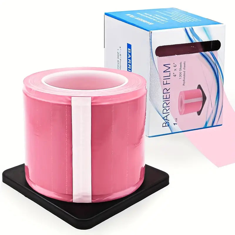 Pink tattoo barrier film roll with packaging on a white background