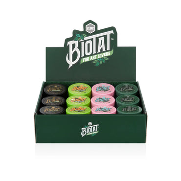 Display box of Biotat products with assorted tattoo butter jars on a white background