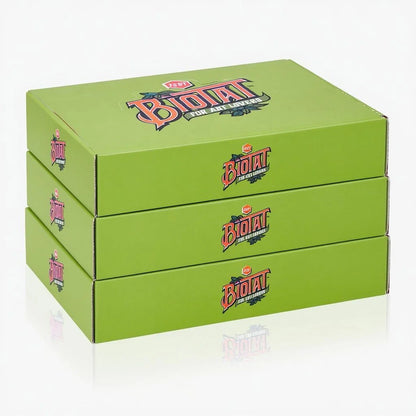 Three stacked lime green retail display boxes of Biotat Zest tattoo butter for studios on a clean white background with a soft reflection underneath