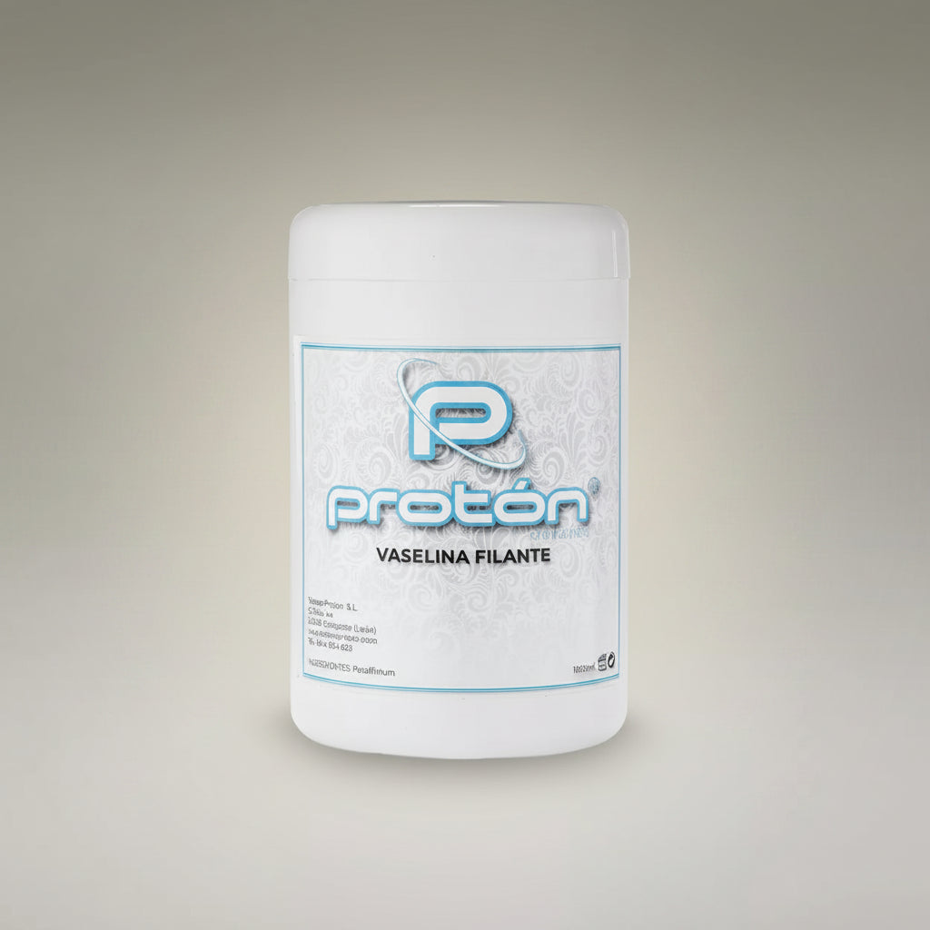 A white plastic jar of Protón Vaseline Filante (petroleum jelly) with a white and blue label, set against a neutral gray gradient background.