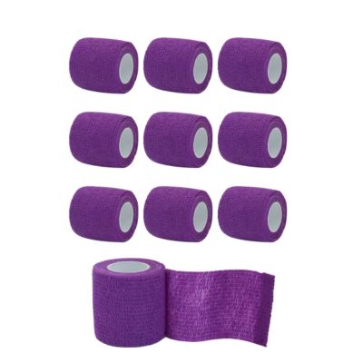 Nine rolls of purple tattoo grip wrap for tattoo machines in a grid with one roll partially unrolled at the bottom, showing the textured fabric and white inner core on a plain white background.