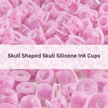 Pink skull-shaped silicone ink cups with text overlay on a white background