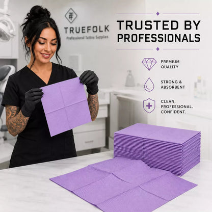 A woman in black scrubs and gloves holds a purple lap cloth in a bright studio setting. Stacked purple pads and an unfolded pad sit on a white counter, with promotional text reading 'Trusted by Professionals' and product benefits on the right.
