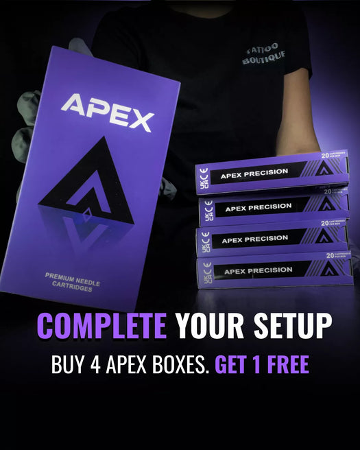 APEX brand needle cartridges packaging shown with a large purple box and four stacked APEX PRECISION boxes on a dark studio background. A person in a black T-shirt is partially visible behind the products, and promotional text at the bottom reads 'COMPLETE YOUR SETUP BUY 4 APEX BOXES.