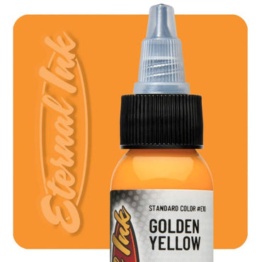 Bottle of Golden Yellow tattoo ink with 'Eternal Ink' branding on an orange background