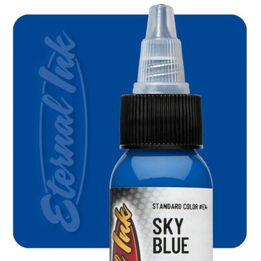 Bottle of sky blue tattoo ink with 'Eternal Ink' branding on a blue background
