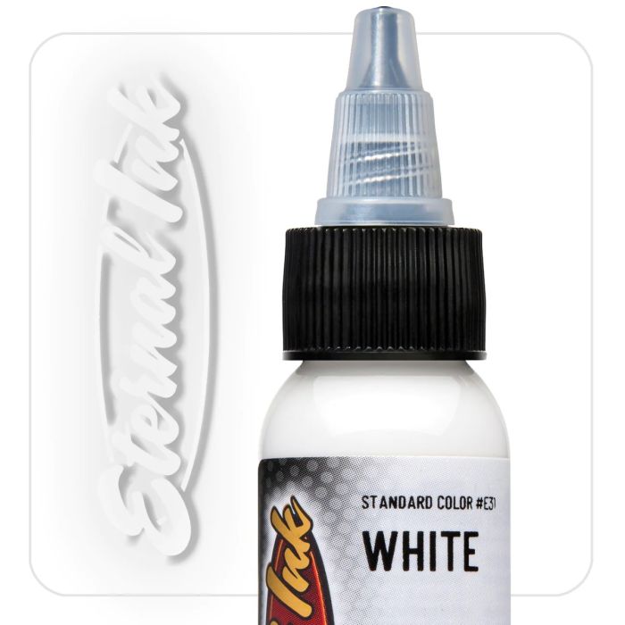 Bottle of white eternal tattoo ink with a black cap and a comb on a white background