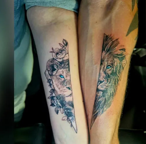 Two tattoos of lions on a person's legs with one lion having blue eyes.