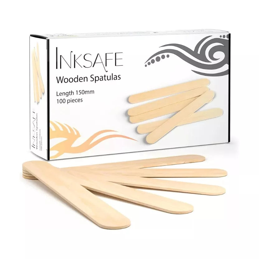 A box of Inksafe Wooden Spatulas with several light natural wood spatulas displayed in front on a white 