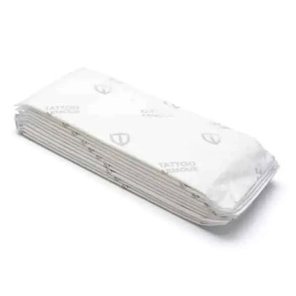 Tattoo armour dressing pads Stack of white paper towels with 'Tattoo' branding on a white background