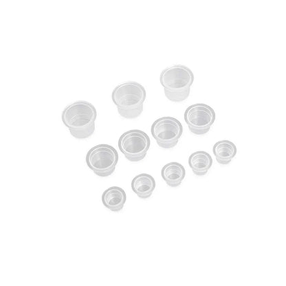Tattoo ink cups in a white background